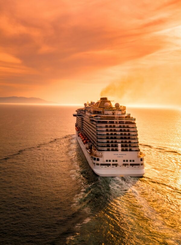 "Luxury cruise tour with a breathtaking sunset on the horizon, creating a peaceful and picturesque scene on the open water.