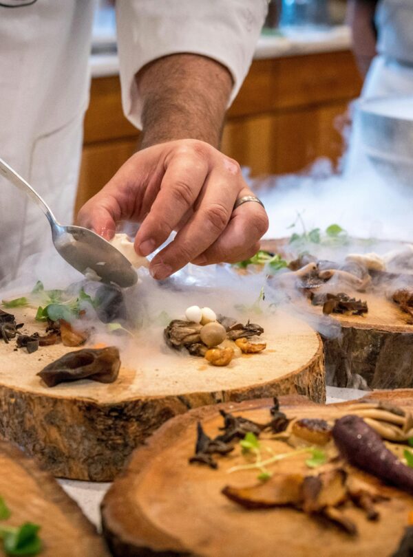 A group of tourists exploring local markets and tasting regional specialties during a guided food tour.