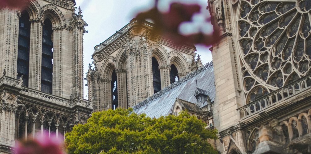 Notre-Dame de Paris, the iconic Gothic cathedral in Paris, France, showcasing its towering spires, flying buttresses, and intricate stained glass windows.