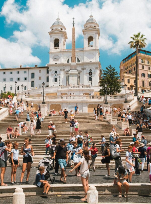 A group of people walking through a city on a guided walking tour, exploring local landmarks and learning about the area’s history.