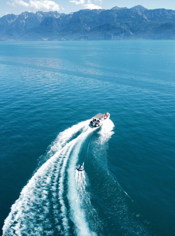 People boating on a calm body of water.